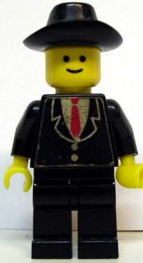 Patron - Black Suit with Two Buttons and Red Tie (Torso Sticker), Black Legs, Black Cowboy Hat
Komplett. Litt skjevt klistremerke og noe slitasje.